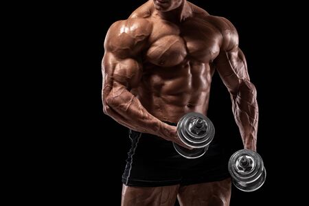 Muscular man isolated on the black background. Strong male naked torso absの写真素材
