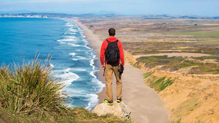 Travel in Point Reyes National Seashore, man Hiker with backpack enjoying view, California, USAの写真素材