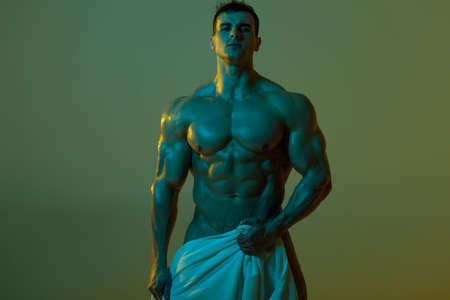 Sexy muscular man  fitness model with towel. Strong male  torso absの写真素材
