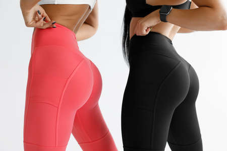Fitness models in leggings with beautiful buttocks. Sporty bootyの写真素材