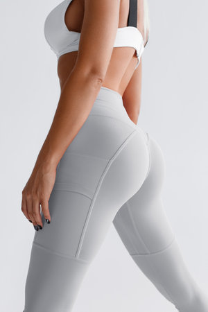 Fitness model in leggings with beautiful buttocks. Sporty bootyの写真素材