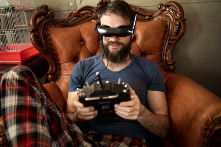Attractive Caucasian Man Hold Joystick And Wear Virtual Reality Glassesの写真素材