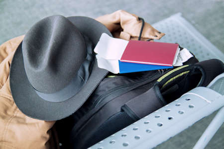 passport and ticket for traveling on a chair at the airportの写真素材