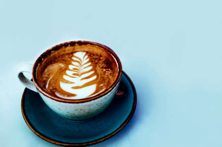 Closeup Cup Of Hot Coffee Tulip Latte Art On Wood Tableの写真素材