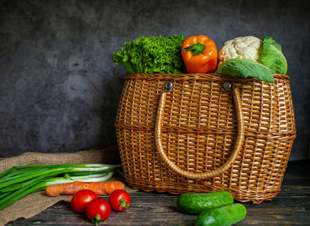 The table, decorated with vegetables and fruits. Harvest Festival. Autumn background. Selective focus. Horizontal.の写真素材