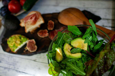 Ealthy Breakfast Avocado Toast and figs. Avocado Toast On Whole Grain Sandwich Bread.