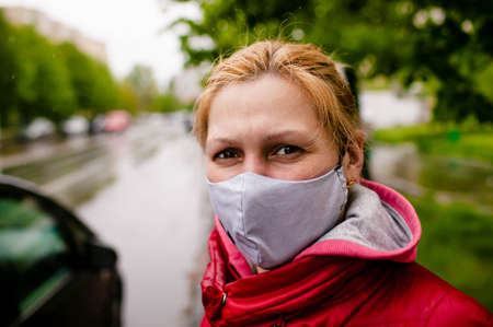 Young Business Woman With Surgical Mask Waiting Bus On Bus Stop In City Stree