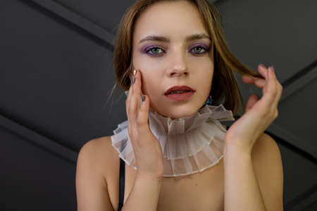 Portrait Of Beautiful Blonde Woman With Blue Eyes In Studio Background.の写真素材