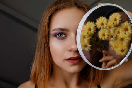 Portrait Of Beautiful Blonde Woman With Blue Eyes In Studio Background.の写真素材