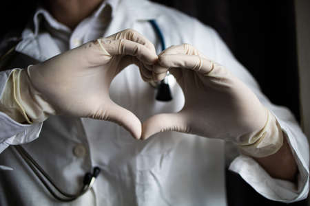 Doctor With Stethoscope Hand Love Heart Gestureの写真素材