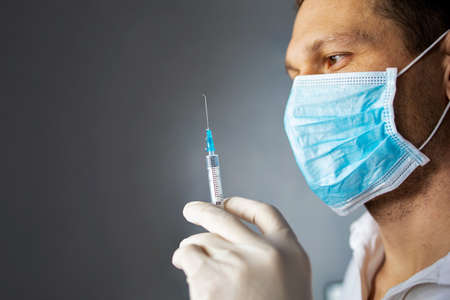 Doctor Holding An Injection At The Hospitalの写真素材