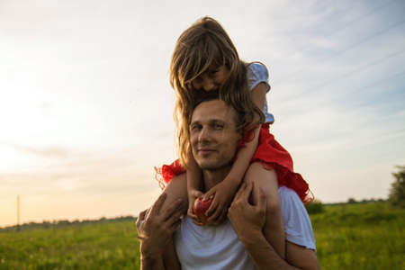 Happy Father And Daughter Playing At Summer Park.の写真素材