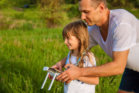 outdoor recreation Leisure for family. Birthday gift. A man and little girl launch a...