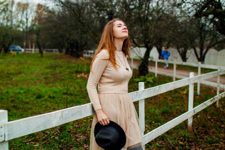 Cute Happy Woman With Long Hair In Forest In Autumn Season. Autumn Atmospheric Portrait Of An...