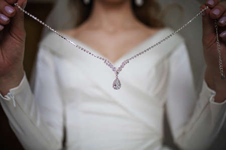 Happy bride on her wedding day. Sensual woman with jewelry.の写真素材