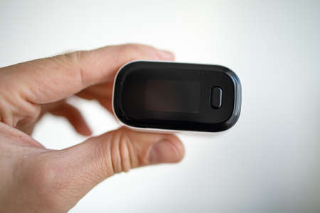Pulse Oximeter Measure Pulse Rate And Oxygen Saturation Level On Male Finger