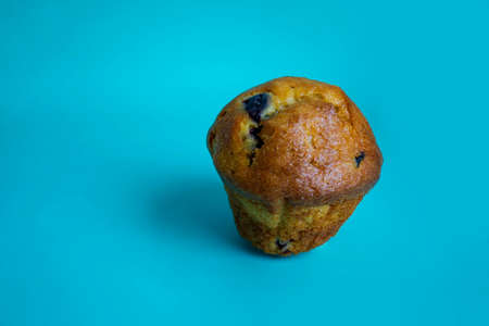 Blueberry And Vanilla Muffins Pastry Dessert Cake On Blue Background.の写真素材