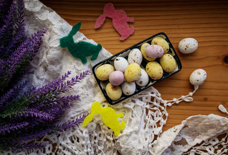 Composition With Beautiful Easter Eggs On Wooden Table.
