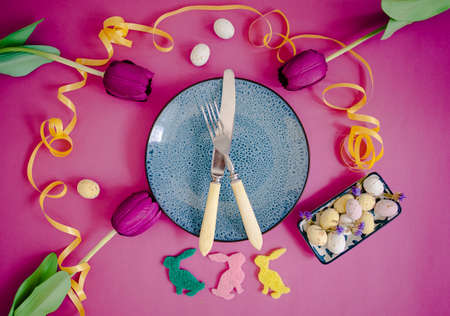 Easter Table Setting With Floral Decor On Pink Table. Elegance Dinner.