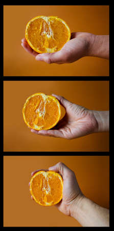 Woman's Hands Holding Halves Of Orange On Yellow Orange Background.の写真素材