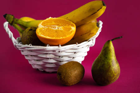 Fruits In The Basket On Pink Background.の写真素材