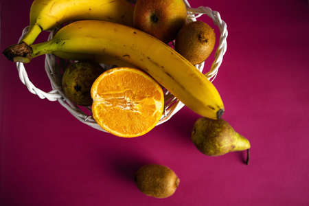 Fruits In The Basket On Pink Background.