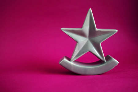 Christmas Five Pointed Golden Star On Pink Background. Christmas Decoration.の写真素材