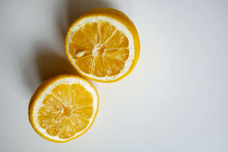 Sliced Lemon On The Table. Close Up. White Background
