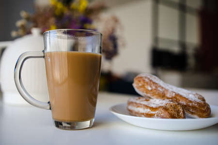 Morning coffee with sweets. With cream filling.