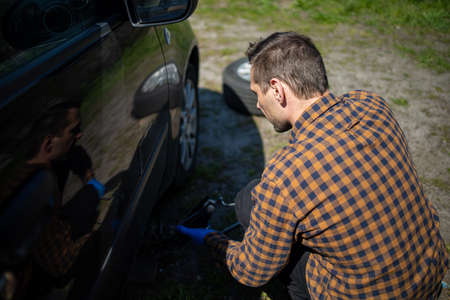 Part Of The Process Of Changing Wheels On A Carの写真素材