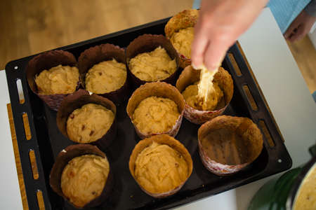 Cook In The Kitchen Preparing Easter Cakes On The Eve Of The Holiday