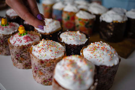 Cook In The Kitchen Preparing Easter Cakes On The Eve Of The Holiday