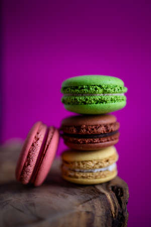 Macaron Cakes Or Macaroon On Colored Background, Sweet And Colorful Dessert