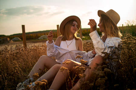Girlfriends Or Sisters Having Fun Outdoor. Cute Positive Portrait Of Best Friend Pretty Youngの写真素材