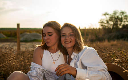 Girlfriends Or Sisters Having Fun Outdoor. Cute Positive Portrait Of Best Friend Pretty Youngの写真素材