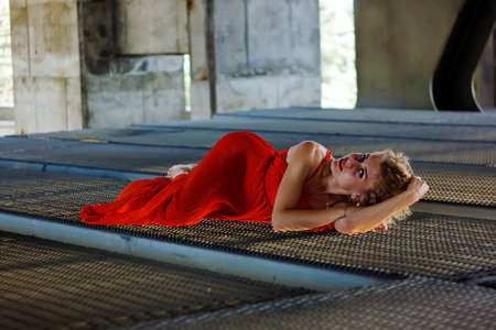 Beautiful Glamor Blonde Woman With Curly Hair In Red Dress
