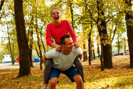 Young Cute Couple Exercising At The City Park. Outdoor Sportの写真素材