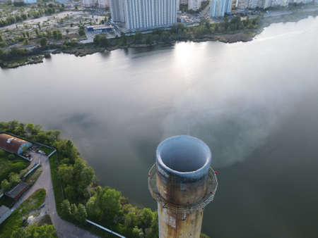 Factory Pipe Releasing Smoke Into Frosty Airの写真素材