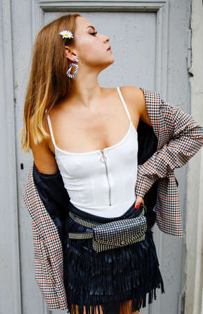 Woman With Black Leather Handbag With Silver Metal Studs