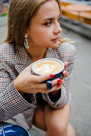 Attractive Business Woman Drinking Coffee In Summer Outdoor Cafeの写真素材