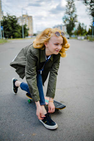 Smiling Teenage Girl Riding Skate Outsideの写真素材