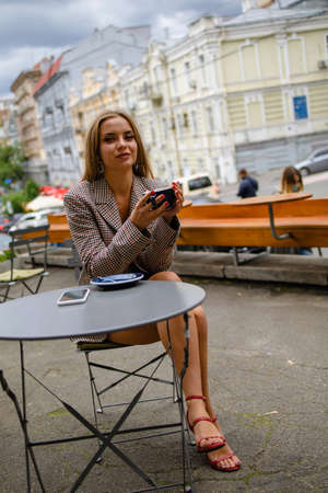 Attractive Business Woman Drinking Coffee In Summer Outdoor Cafe