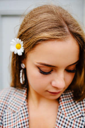 Skin Care And Women Beauty. Nature Beauty Portrait Of A Girl With Chamomile On Face.