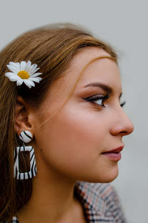 Skin Care And Women Beauty. Nature Beauty Portrait Of A Girl With Chamomile On Face.の写真素材