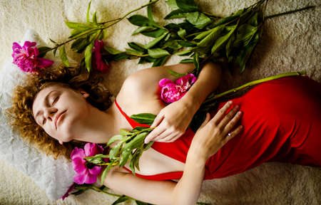Beautiful European Woman With Peony Flowerの写真素材