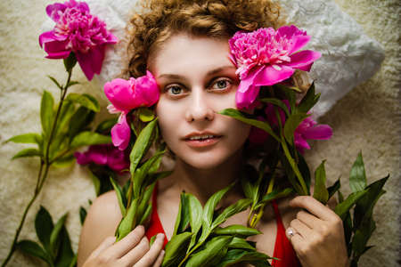 Beautiful European Woman With Peony Flower