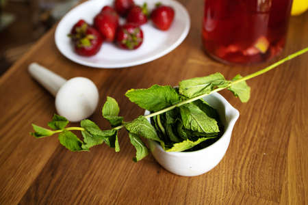 Fruit Water With Lemon, mint And Strawberry In Glass Bottle. Healthy eating