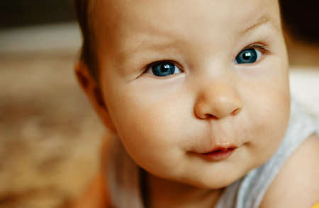 Lovely Happy Smiling Baby Close-up. Infant Playing Home.の写真素材