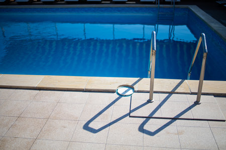 Closeup Beautiful Image Of Metal Stairs In The Swimming Poolの写真素材