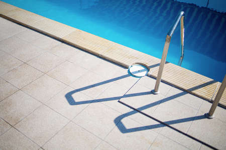 Closeup Beautiful Image Of Metal Stairs In The Swimming Poolの写真素材